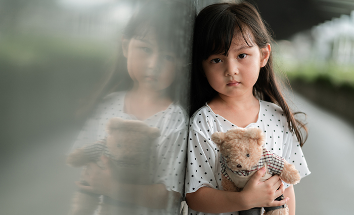 little girl with stuffed bear